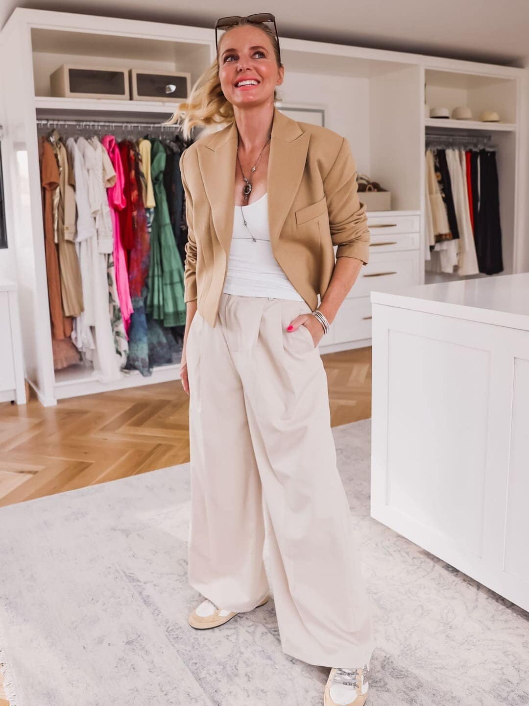 Pleated-trousers-slouchy-trousers-pleated-pant-trend-Free-People-Seamless-v-neck-cami-LAcademie-Ryia-pant-cropped-blazer-Ballstar-Golden-Goose-Sneakers-Erin-Busbee-Busbee-Style-Fashion-Over-40-5-e1686327917407