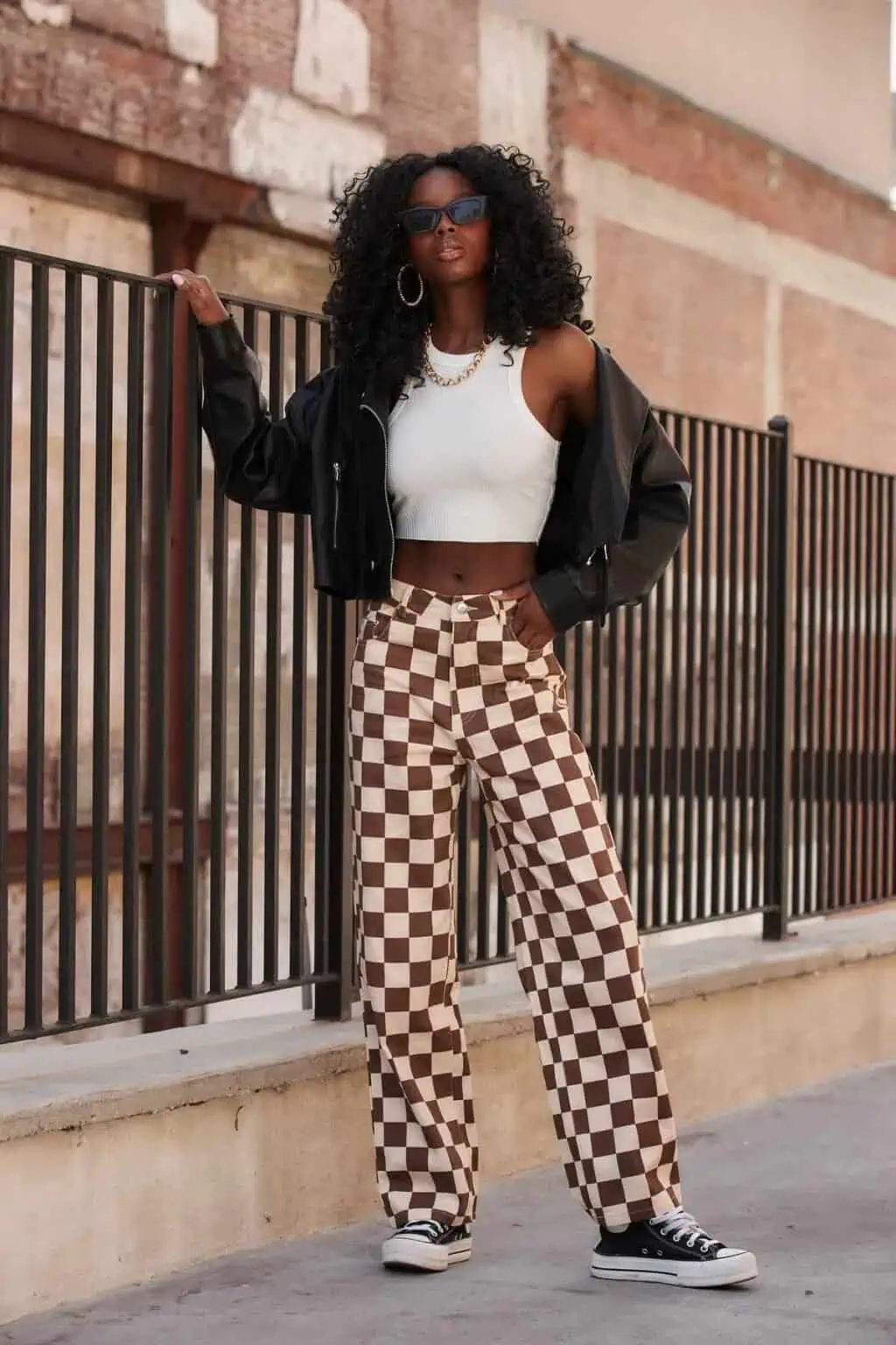 what-to-wear-to-a-rap-concert-brown-checkered-baggy-jeans-with-white-tank-top